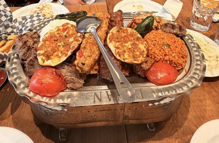 Divan Turkish Cuisine family platter with grilled meats, rice, flatbread and vegetables
